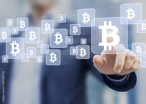 Bitcoin trading and investment concept, businessman touching BTC currency symbol