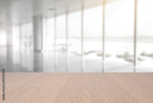 top empty wood table on blurred abstract hallway background. can be used for display or montage your product.