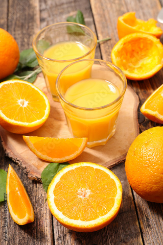 orange juice on wood background