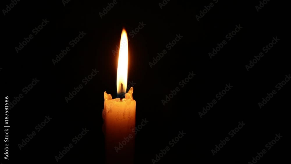 Single lit candle with quite flame