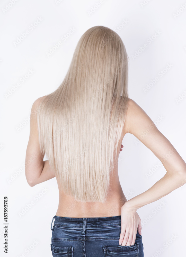 Sexy shot from the back. Girl with perfect blonde hair posing in a jeans. –  Stock-Foto | Adobe Stock