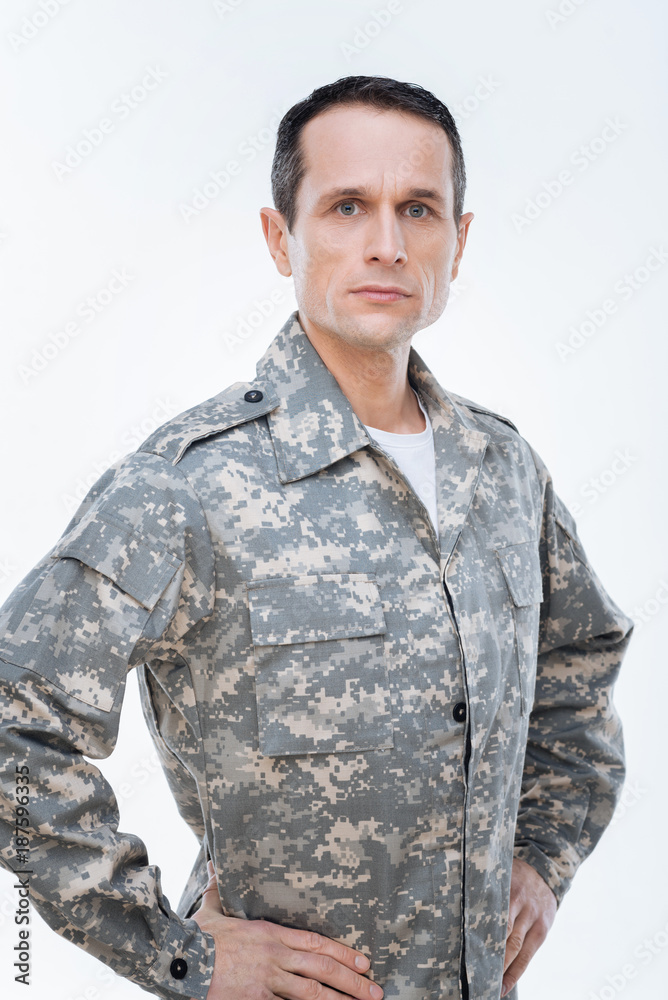 US military. Nice pleasant confident serviceman looking in front of him and thinking about his country while doing his job US military. Nice pleasant confident serviceman looking in front of him and thinking about his country while doing his job