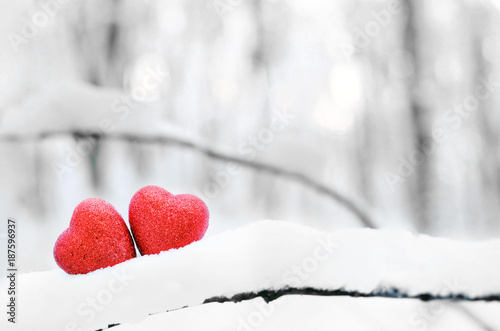 Red heart on snow background. St. Valentine's Day