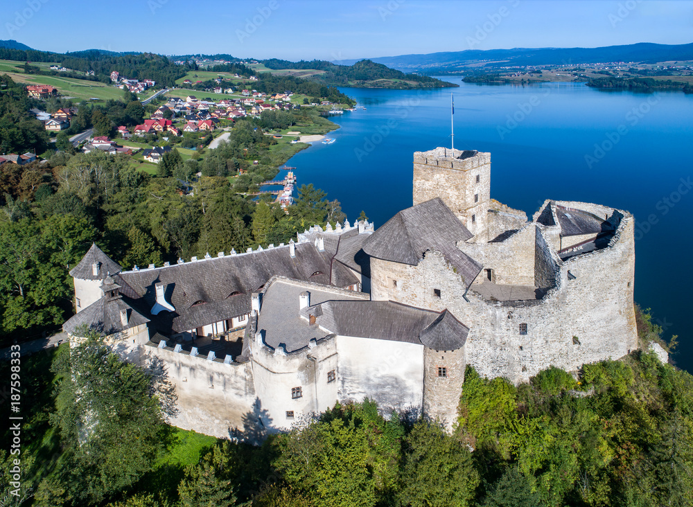 Poland. Medieval Castle in Niedzica, built in 14th century and artificial Czorsztyn Lake. Aerial view in the morning