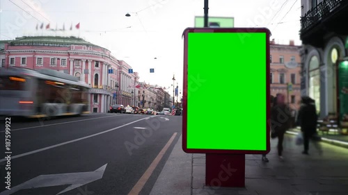 Time Lapse . Billboard with a Green Screen on the Busy Roadway.