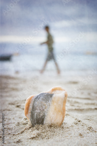 Stone in the sand at the seaside