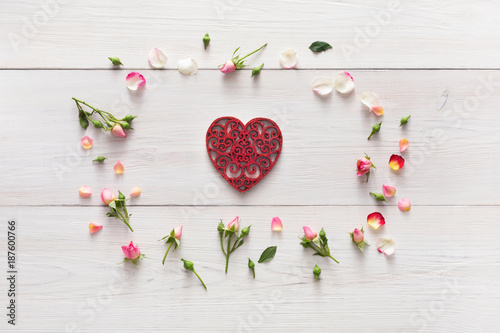 Fototapeta Naklejka Na Ścianę i Meble -  Valentine background with handmade heart shape paper card in pink rose flowers circle on white rustic wood