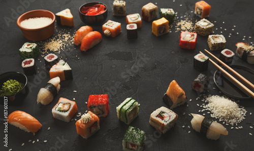 Sushi and rolls background, frame on black