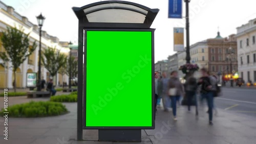Time Lapse. A Billboard with a Green Screen on a Busy Street