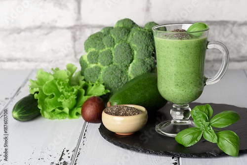 Healthy food: green smoothies from avocado, spinach, broccoli, cucumber and chia seeds on a light background photo