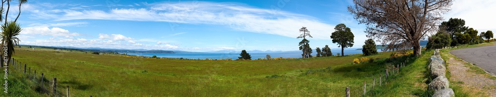 Snow capped peak of Mount Ruapehu covered by clouds seen across Lake Taupo in New Zealand Snow capped peak of Mount Ruapehu covered by clouds seen across Lake Taupo in New Zealand