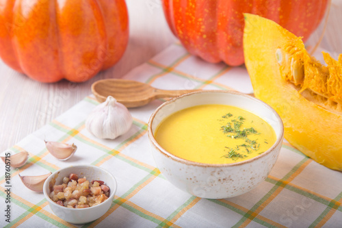 Pumpkin soup with fried onion and bacon
