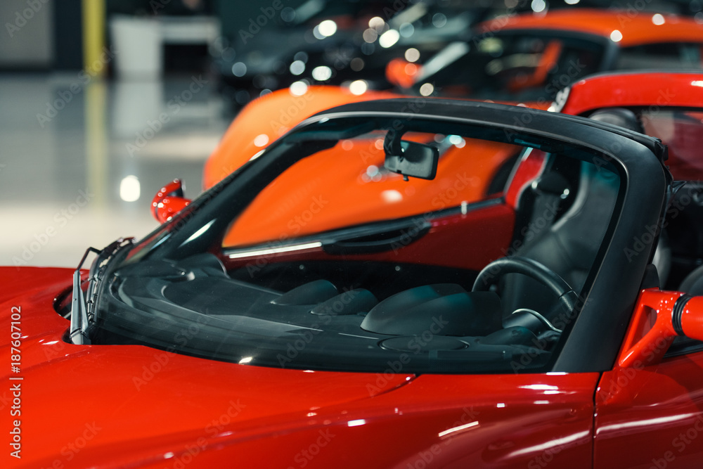 sport cars standing in row at car showroom sport cars standing in row at car showroom