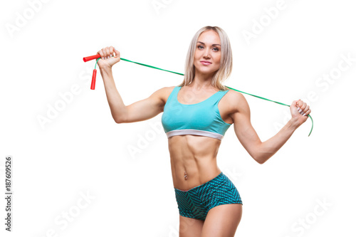 Sport, activity. Cute woman with skipping rope. Muscular woman white background.