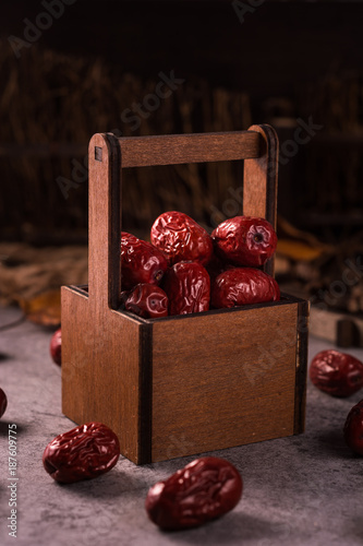 Dried jujube fruit on wooden table photo