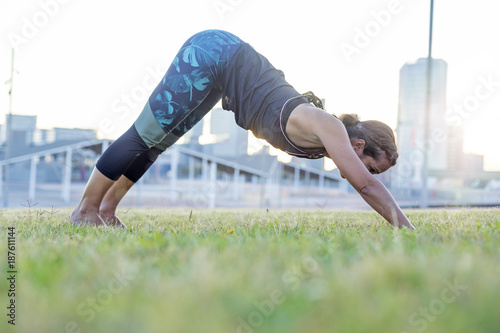 A Young woman doing yoga exercise outdoor