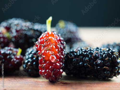 Mulberry on wood table, is the only natural plant of the Bombyx mori. Mulberry can be eaten.