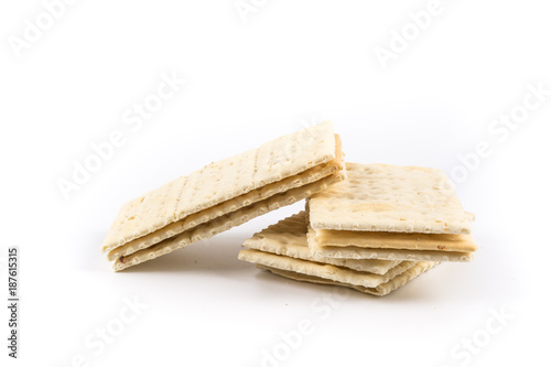 Stack of sweetmeal digestive biscuits isolated on white. photo