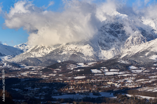 The village of Saint-Bonnet-en-Champsaur and the Petit Chaillol mountain peak in winter. Drac Valley, Hautes-Alpes, French Alps, France © Francois Roux