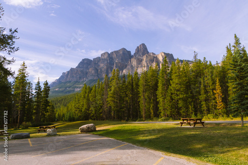 Parking lot with picnic table in beautiful landscape in Rocky Mountains in Canada during sunset