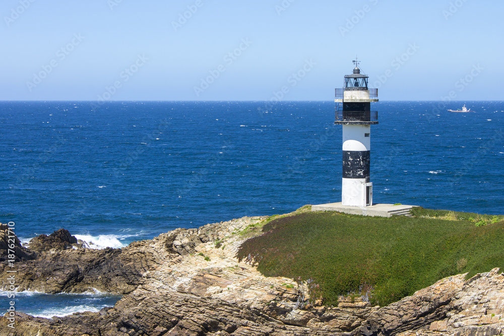 Illa Pancha in Ribadeo, Spain, a beautiful island with two lighthouses guarding the Eo estuary that delimits the border between Galicia and Asturias