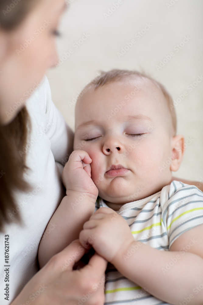 Mother lulling her baby at home Mother lulling her baby at home
