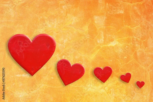 Five hearts on yellow wall background
