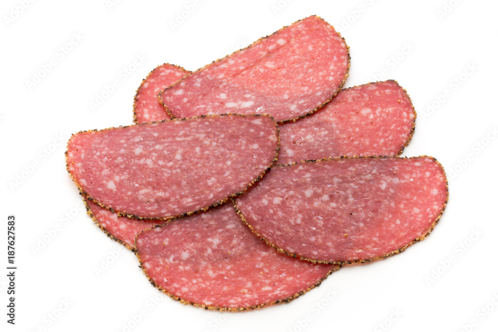 Salami slices isolated on the white background. Salami slices isolated on the white background.