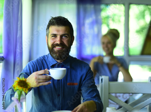 Morning coffee time concept. Man with beard and happy face