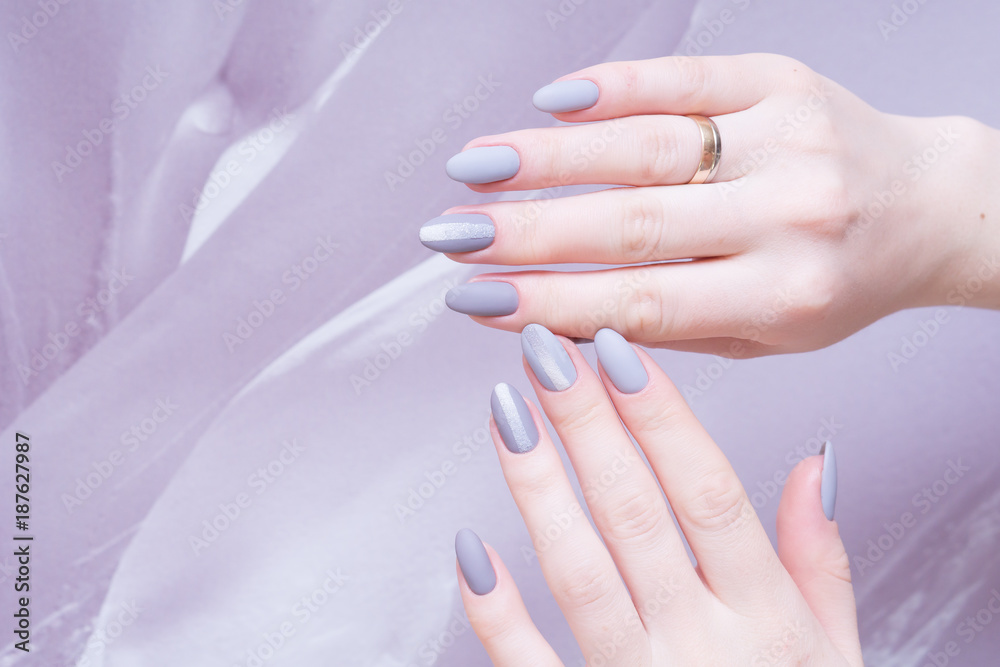 Attractive manicure on women's hands. Natural finger nails with stylish nail art. Attractive manicure on women's hands. Natural finger nails with stylish nail art.