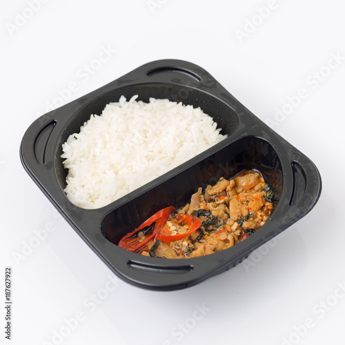 Isolated of stir-fried pork and basil in a package that can be microwave.
