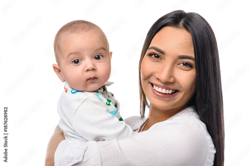 portrait of cheerful mother with infant baby on hands isolated on white