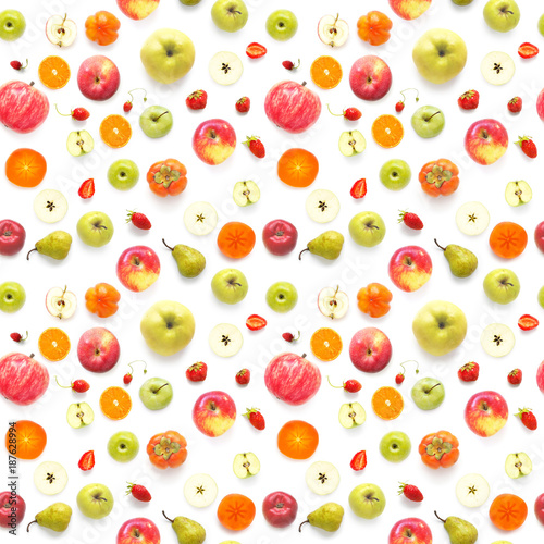 Fototapeta Naklejka Na Ścianę i Meble -  Food texture. Seamless pattern of fresh  various fruits. Pears, apples, slices of tangerines, kiwi, berries isolated on white background, top view, flat layout.