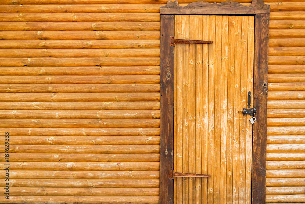 old weathered wooden door with a leather cord