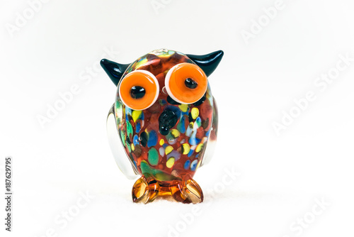 Colorful glass owl figurine isolated on white background