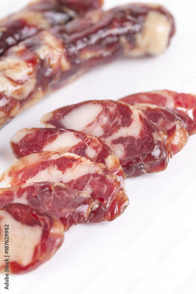 Raw sausages and slices on a white background. Raw sausages and slices on a white background.