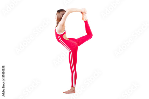 attractive woman in the red sports jumpsuit standing in Natarajasana exercise, Lord of the Dance pose, working out, wearing sportswear, lisolated on white backgroun. photo