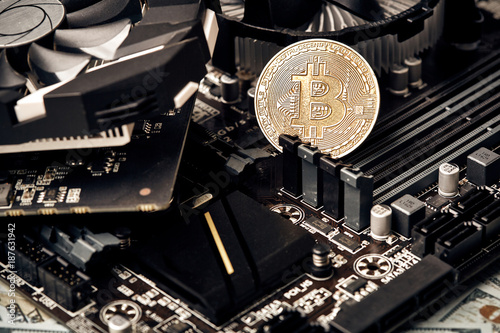 Bitcoin. New virtual money. Bitcoins lie on the video card, concept of mining.