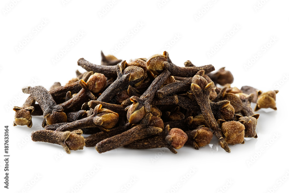 A pile of dry cloves isolated on white.