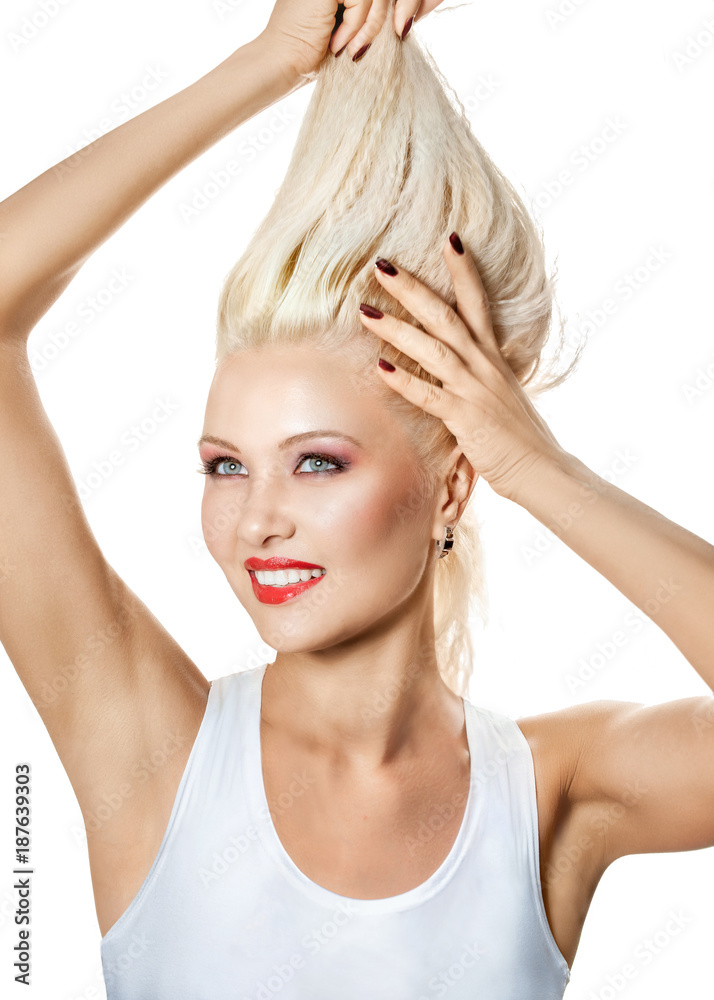 Beautiful smiling blonde, holding her long hair Beautiful smiling blonde, holding her long hair
