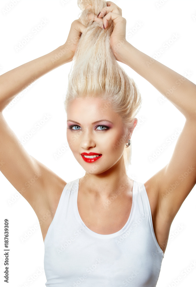 Fototapeta premium Beautiful smiling blonde, holding her long hair