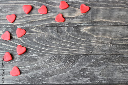 Valentine's Day . Red hearts on a wooden background. photo