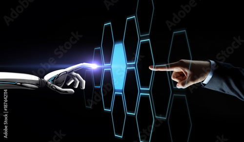 robot and human hand touching network hologram