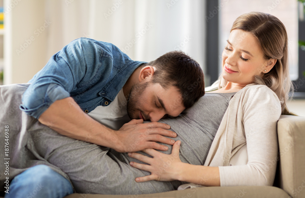happy man with pregnant woman at home happy man with pregnant woman at home