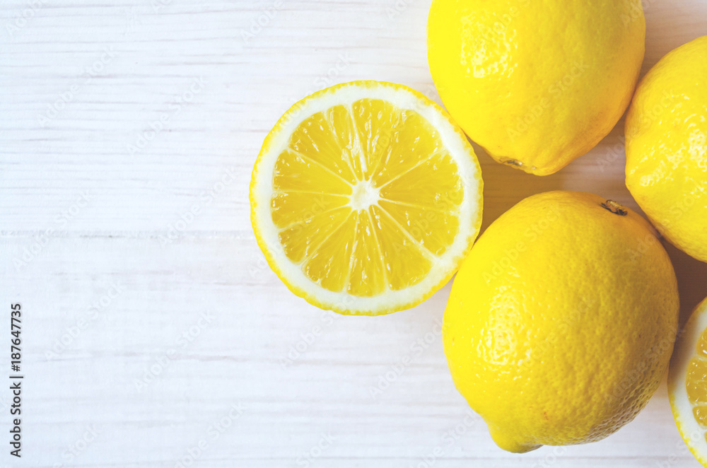 Close up juicy lemons on a white wooden background. Healthy food. Close up juicy lemons on a white wooden background. Healthy food.