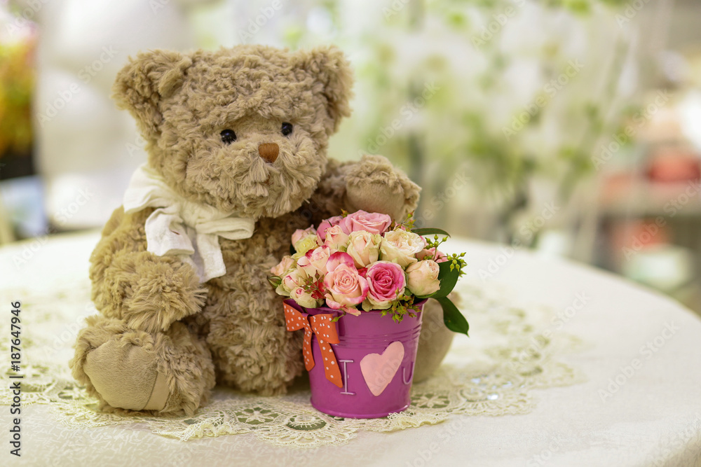 Toy teddy bear with a bouquet of flowers, background,Postcard, Valentine's Day, Women's Day