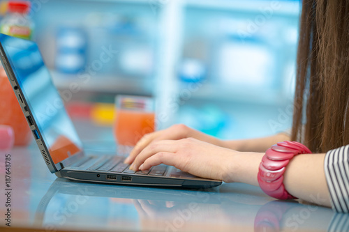 Hands girl working on laptop