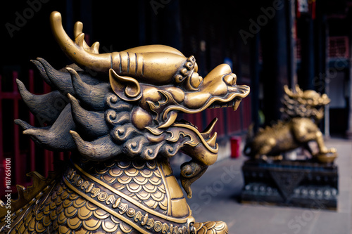 Close up of lion bronze head statue in a temple of China