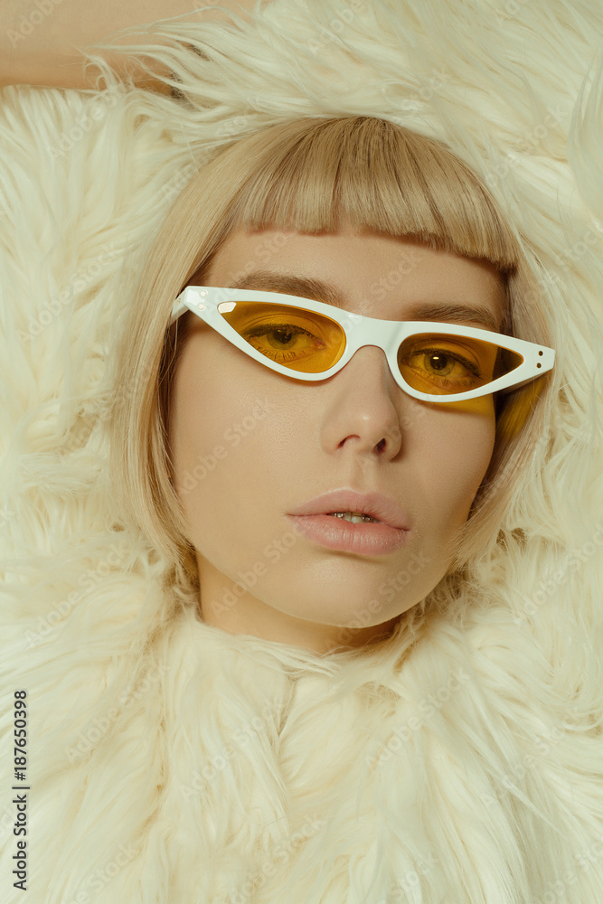Blonde girl with short hair style in fashion glasses Blonde girl with short hair style in fashion glasses