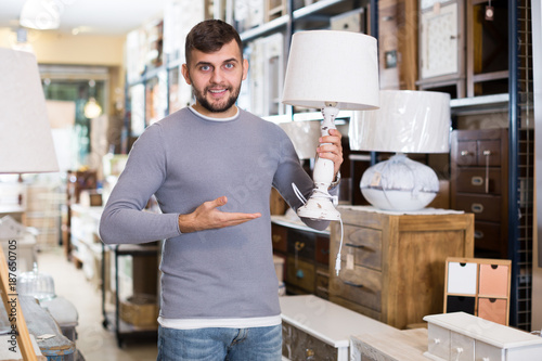 Man satisfied with purchase of table lamp